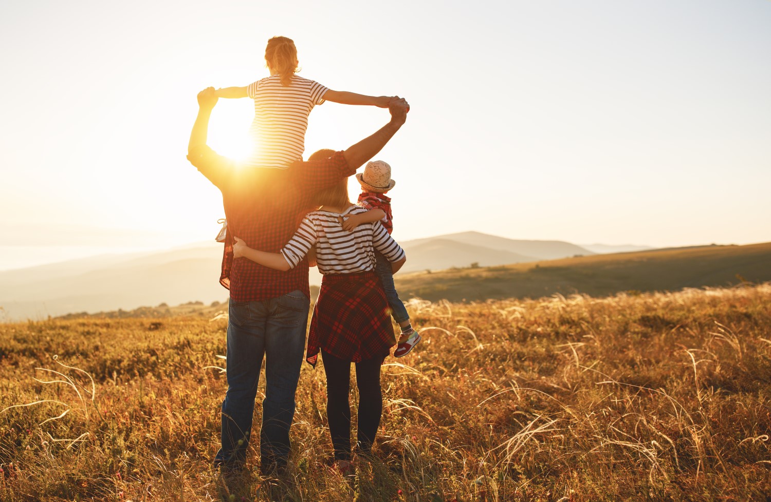 Happy family on sunset