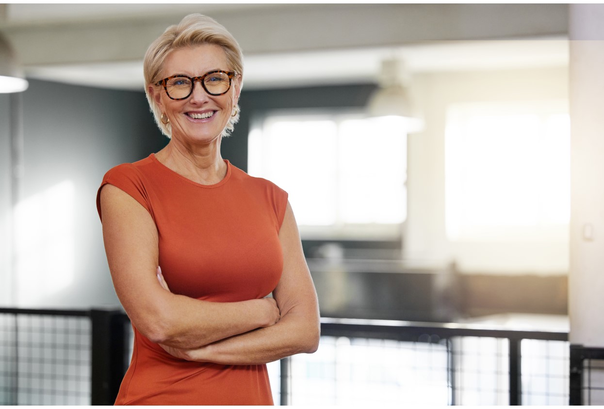 Portrait, arms crossed and smile of business woman